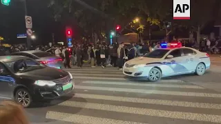 Police presence, people gather on Shanghai streets