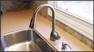 Removing Hard Water Deposits From A Faucet Head