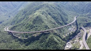 Aerial China The high speed Qianhaizi Double Helix Bridge on the cloud in China