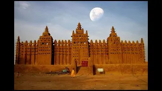 Thousands replaster the Great Mosque of Djenne located in Mali, which is threatened by conflict