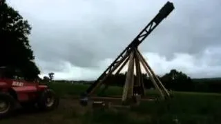 Car flies as it's hurled through the air by medieval trebuchet