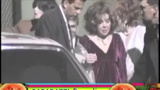 MICHAEL JACKSON helps frail LIZ TAYLOR down stairs