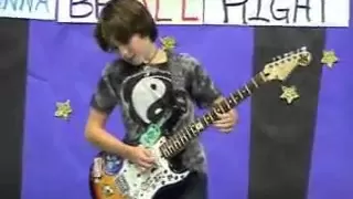 11-year-old plays AC/DC's Back In Black at talent show