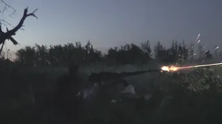 Ukrainian forces battle with heavy machine gun for fire superiority in Ukraine's east Donbas region