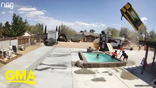 Dust devil caught on camera carrying away bouncy house