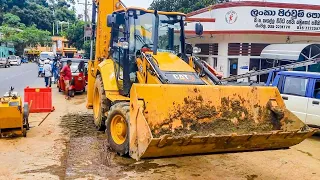 Backhoe Loader Digging Asphalt Busy Road To Repair Underground Pipe Line CAT 428 | Routine Machines