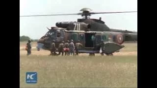 RAW: Bulgarian, U.S. paratroopers jump from air during drill