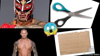 BIG TWO RKOs ON REY MYSTERIO WITH CARDBOARD AND SCISSORS 😜😜