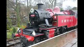 Diesel rail car M79964 and LMS Ivatt steam train 41241 at Oxenhope Station on 9 January 2022