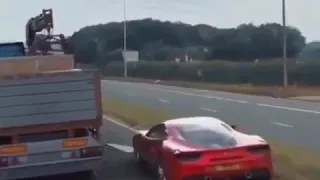 Ferrari 488 goes under truck fast and furious style to escape cops