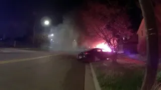 Bodycam footage captures Lansing police officer pull people from burning car