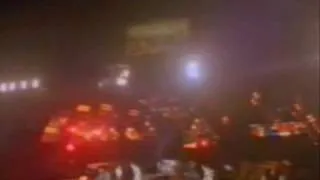 John Deacon Throws His Bass Guitar