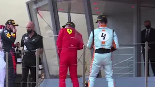 Lando Norris and Carlos Sainz pushing eachother on the podium