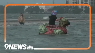 Idalia: Man on inflatable duck in Tampa flooding