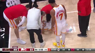 Hawks Trae Young  an apparent leg injury.