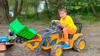 Darius rides on Tractor and rescues the Car from the mud Road Signs for kids