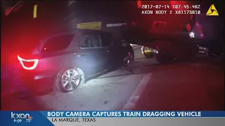 Body cam captures footage of train moving with SUV partially underneath it