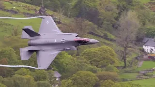 F35 Fighter Jets from the USAF very LOW over a wet and windy Ullswater in the Lake district UK