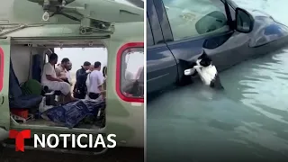 Dramáticos rescates de personas (y un gato) por las inusuales lluvias en Dubai | Noticias Telemundo