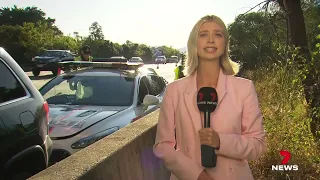 Horror crash on M1 leaves four people including children and officer | 7 News Australia