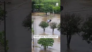 Texas driver gets stuck in floodwater as onlookers scream