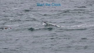 Surfski remount in strong tidal flow and bumpy seas.