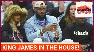 What point was LeBron James trying to make by sitting courtside at the Cleveland Cavaliers game?