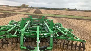 Cat Challenger pulling a JD 2730