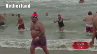 Brave souls take New Year dip into cold water in Europe !