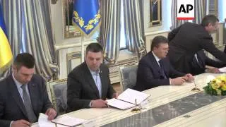 Yanukovych and opposition leaders sign deal for early elections and new govt in hope of ending crisi