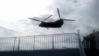 Royal Marines "Playing" around our passenger ferry in Chinook helecopters