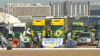 Partidários de Bolsonaro seguem na Esplanada dos Ministérios | AFP