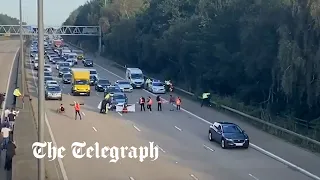 Insulate Britain protesters run in front of cars to block M25 again
