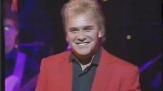 Kevin McMillan playing keyboard with Freddie Starr at the Royal Command Performance in 1989