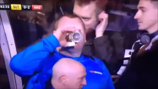 Sutton United vs Arsenal Goalkeeper Wayne Shaw eating a pie during  the game