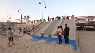 Watch visitors try out the slides at Pismo Beach's Pier Plaza