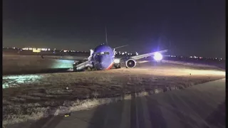 Plane skids off runway