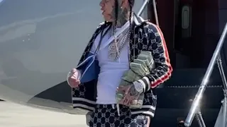 6ix9ine getting off his private jet with stacks