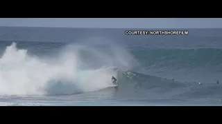 3 surfers catching a set of perfect waves at Pipeline