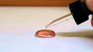 Surface tension of liquid - water vs. Alcohol