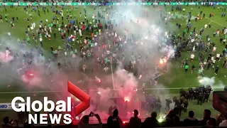 Saint-Etienne fans storm pitch, hurl flares after team relegated from Ligue 1