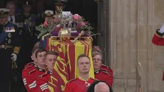 King Charles III leaves Westminster Abbey behind Queen Elizabeth II's coffin