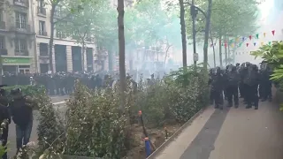 Paris police use tear gas to disperse protesters during May Day march