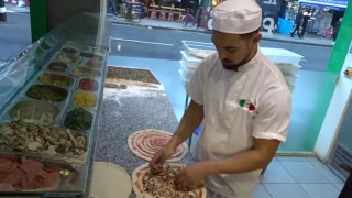 Buying a freshly made Hand Stretched Pizza made by a Master Pizza Maker (Pizzaiolo) at ICCO Pizzeria
