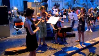 Violinists Perform Pachabel Canon in D Major in Fiumi Fountain in Rome Italy