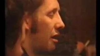 Shane Macgowan singing a ballad in a pub