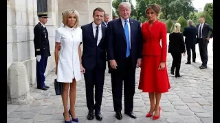 First ladies of fashion! Melania Trump dons demure red Dior skirt suit as France's.