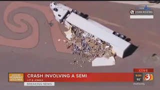 VIDEO: Semi-truck rolls over spills kegs on SB I-17 in Phoenix