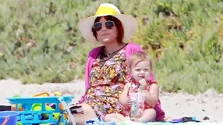 Kourtney Kardashian Ignores Family Drama By Chilling On The Beach [2013]