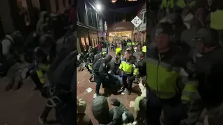 Boston police clash with pro-Palestine protesters as they clear an encampment